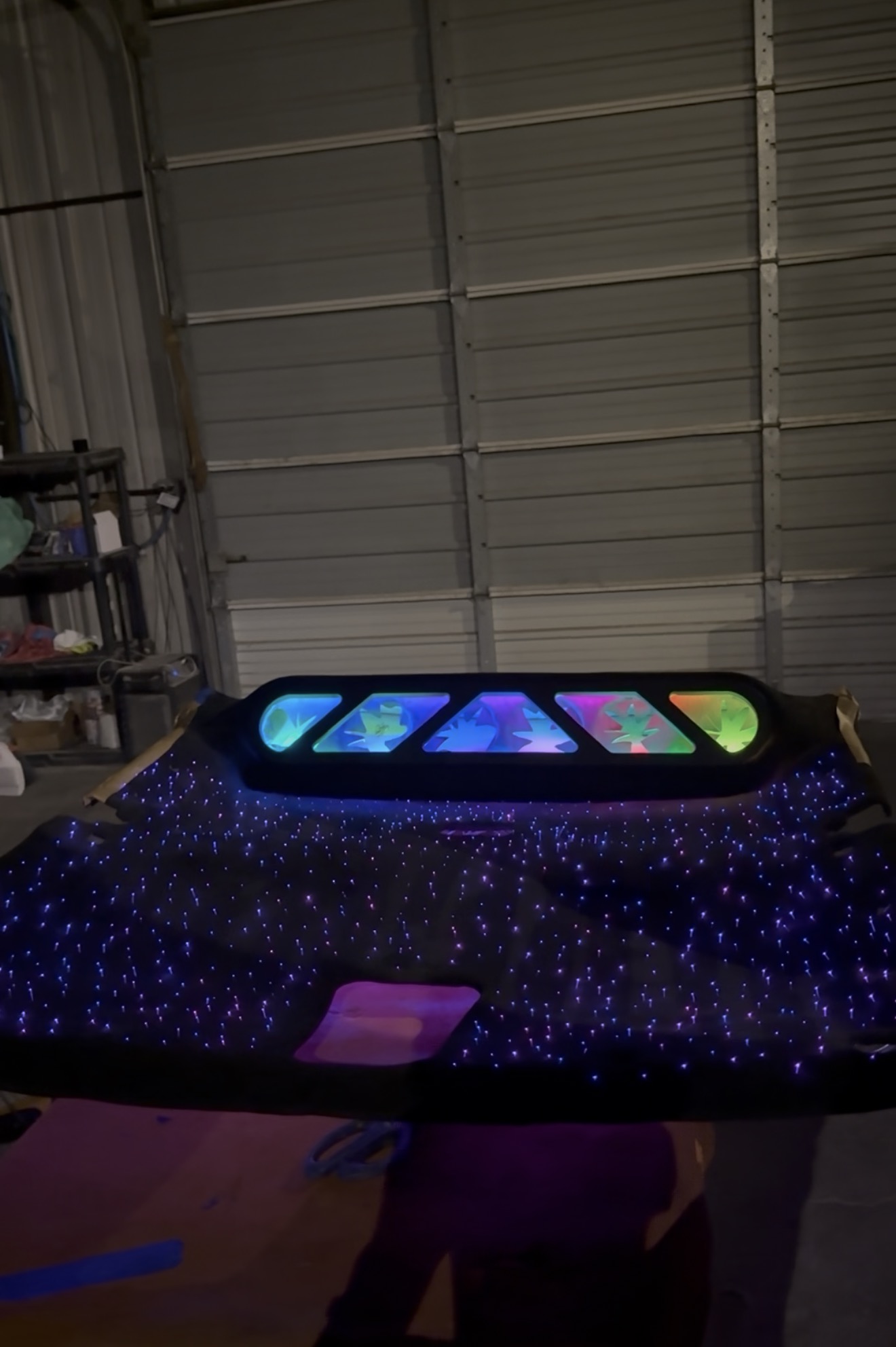 Fabricated overhead console with RGB inserts and fiber-optic starlight headliner on the bench
