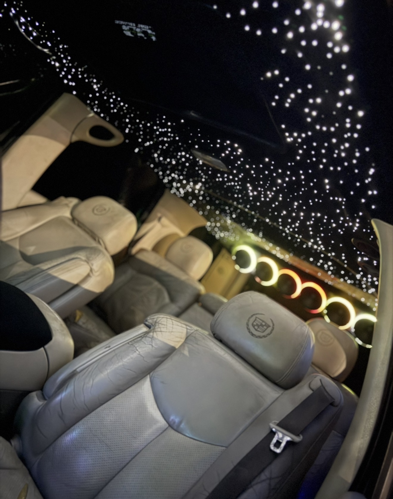Cadillac Escalade interior with white starlight headliner and halo ring speaker rack