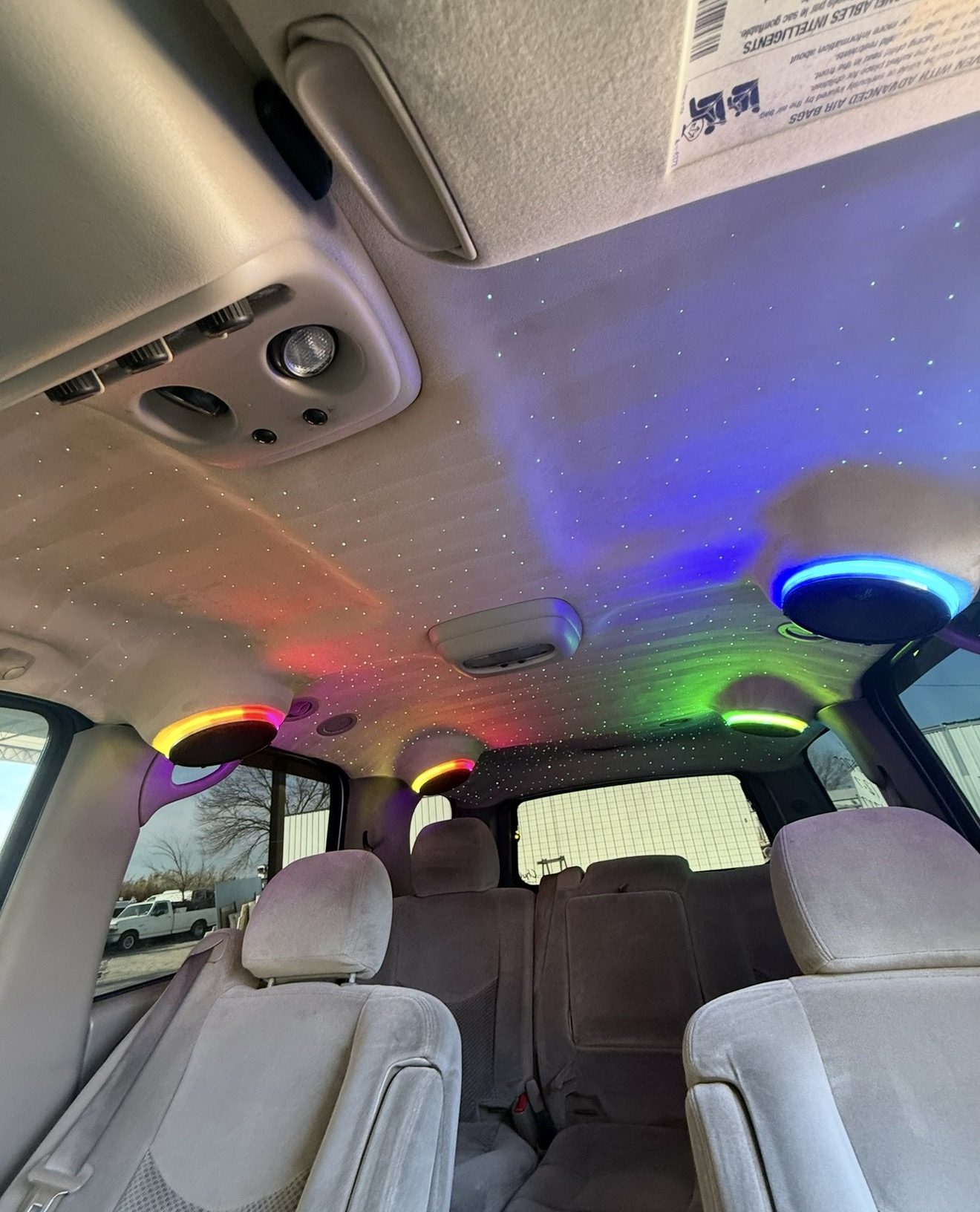 SUV ceiling with starlight headliner and four RGB ring speaker pods